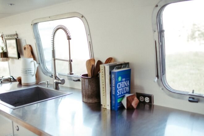 kitchen countertop with sink and cook books