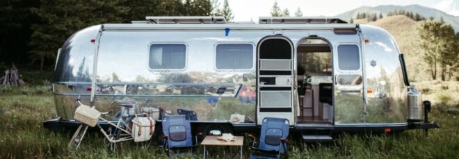 renovated airstream trailer with seating out front