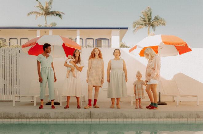 group of friends and their children all wearing organic cotton dresses