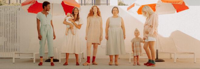 group of friends and their children all wearing organic cotton dresses