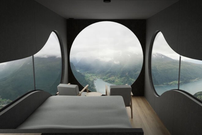 bed in small room with round windows