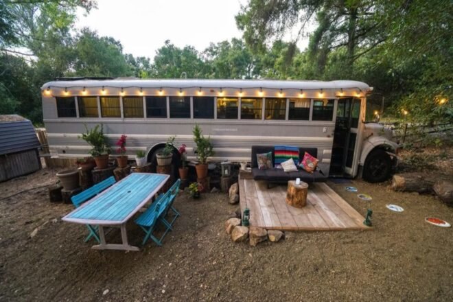 converted school bus home with outdoor seating
