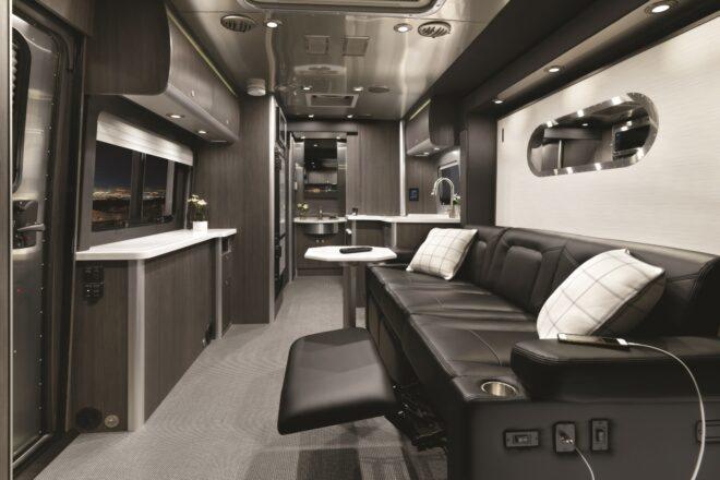 luxurious interior with black sofa and grey accents