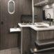 small bathroom with dark grey and black accents