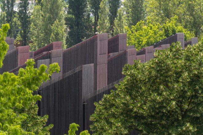 timber building surrounded by greenery