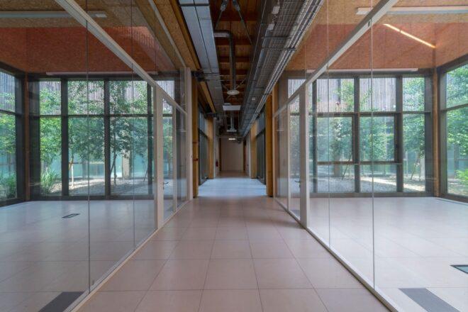 long hallway with glass walls