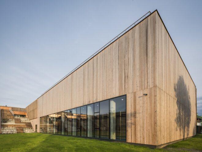 corner angle of a wood paneled building with windows