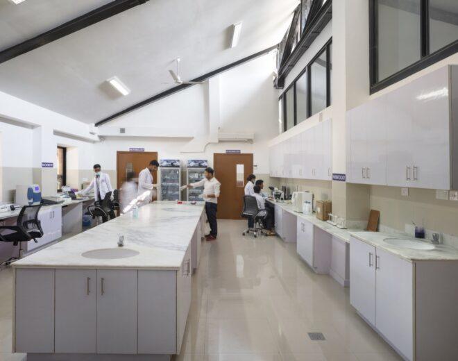 medical lab space with long island with marble countertops