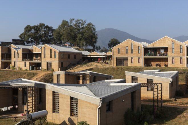 several rammed earth buildings with jagged rooflines
