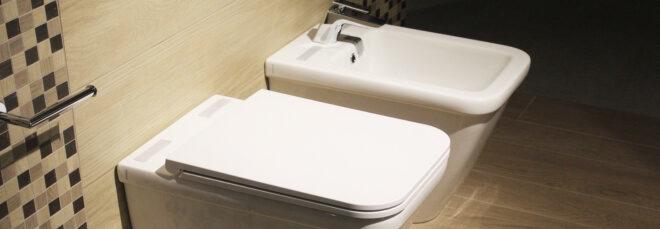 a toilet and bidet in a bathroom