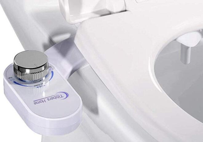 closeup of a bidet attachment for the toilet