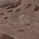 aerial rendering of wind turbine blades scattered in a desert