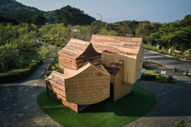 wooden structure with several wood volumes with pitched roofs
