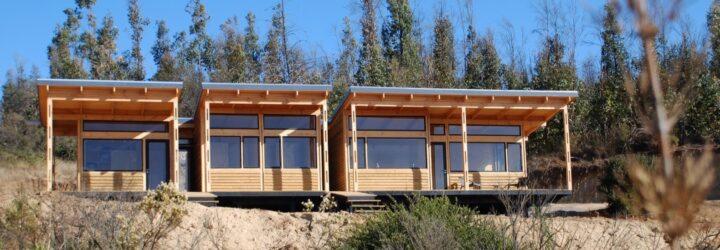 closeup of a rectangular house with windows and wood facade