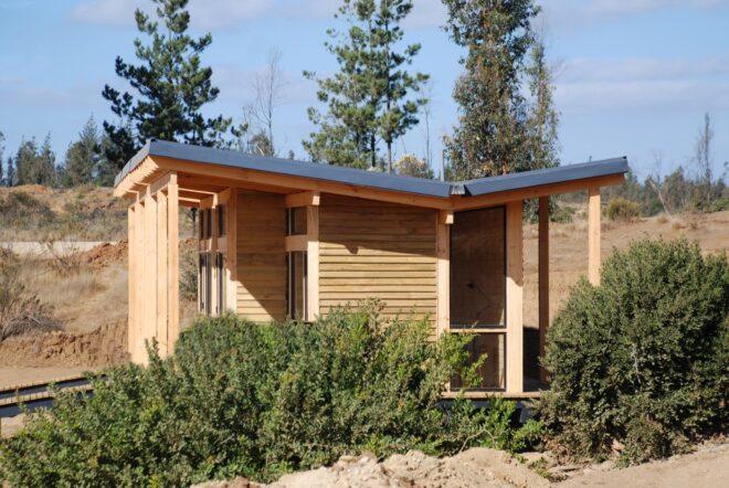 a V-shaped roof on a house with a wood facade