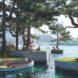 rendering of boat near tree-covered islands