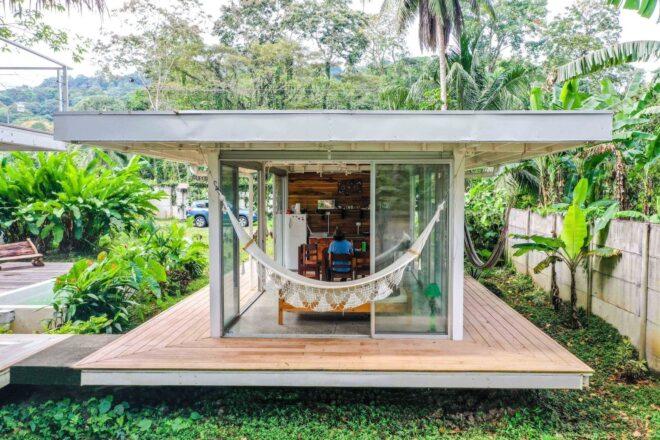 a small cube-like structure with wrap-around deck and a hammock