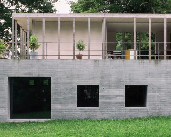 concrete home with pavilion roof