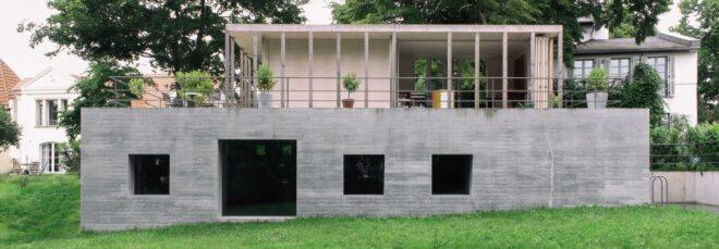 concrete home with pavilion roof