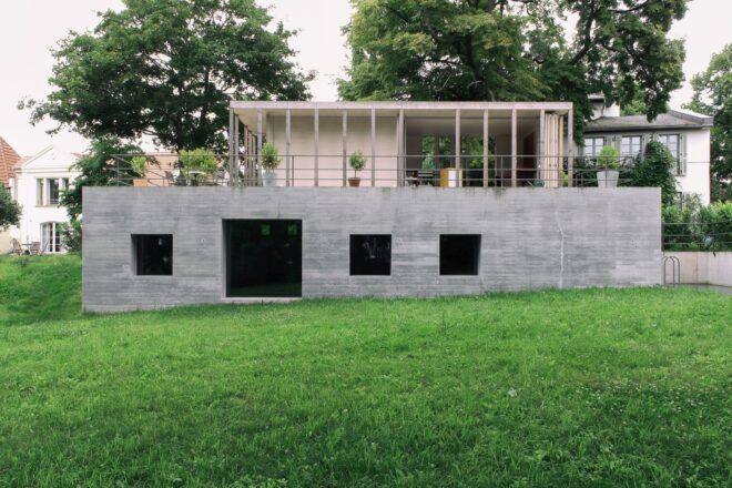 concrete home with pavilion roof