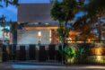 nighttime shot of a house's facade lit from within