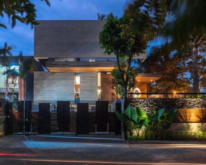 nighttime shot of a house's facade lit from within