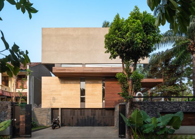 a multi-story home with a facade composed of several different materials, including both light and dark colored wood