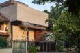 sideview of a multi-story home at sunset