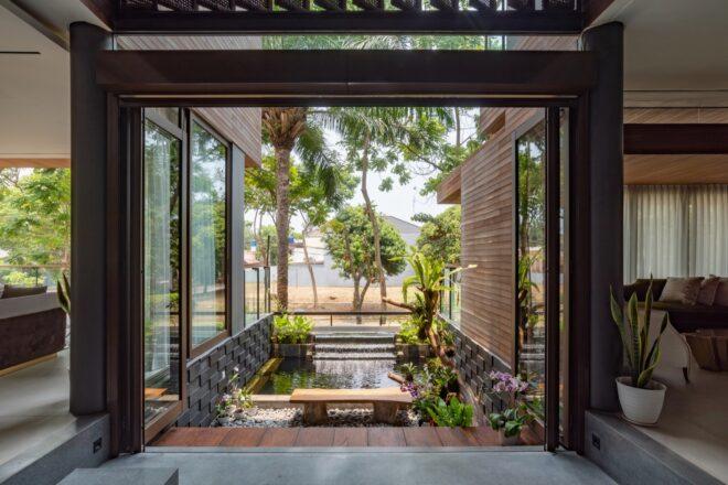 view of a green courtyard space from within the house