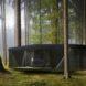 black tiny home in forest