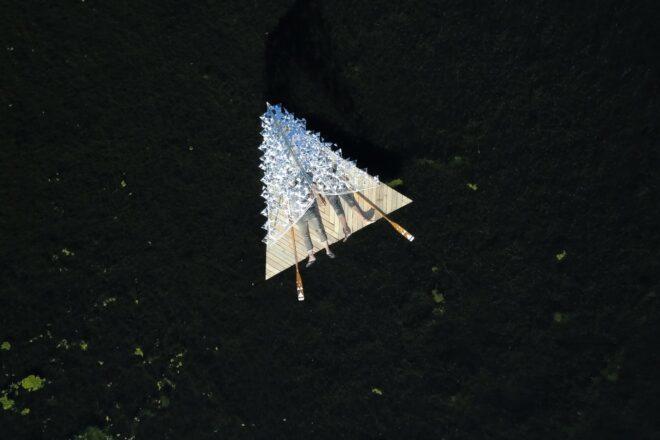 triangular wooden raft in the water