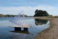 small wooden raft with open triangular cover