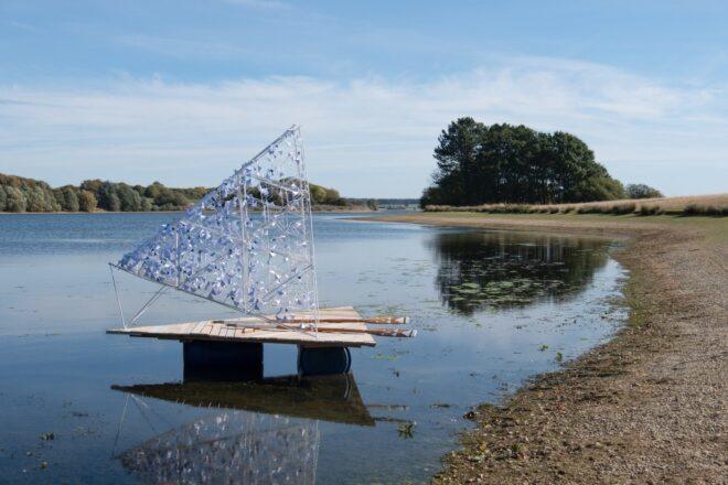 small wooden raft with open triangular cover