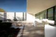 white chairs outside a white villa
