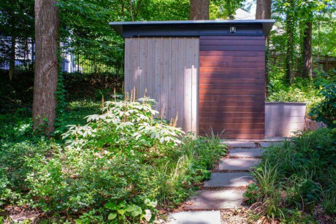 stone walkway leading up to small garden shed