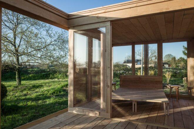 tiny wooden cabin with glass doors