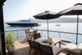 front deck with seating area and umbrellas
