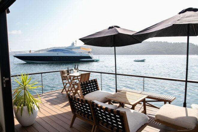 front deck with seating area and umbrellas