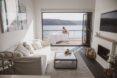 living room with large sliding doors that lead out to deck