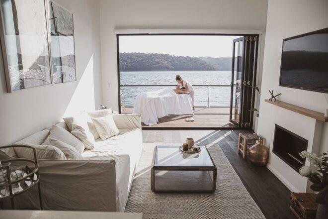 living room with large sliding doors that lead out to deck