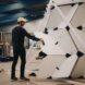 person building a pod with white panels