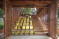 to the left, a staircase-like structure with translucent yellow blocks. to the right, a wooden staircase