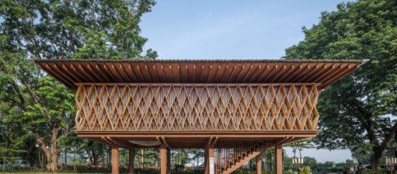 streetview of a rectangular wood building on stilts