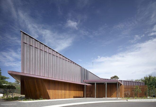 long building with wood and copper exterior