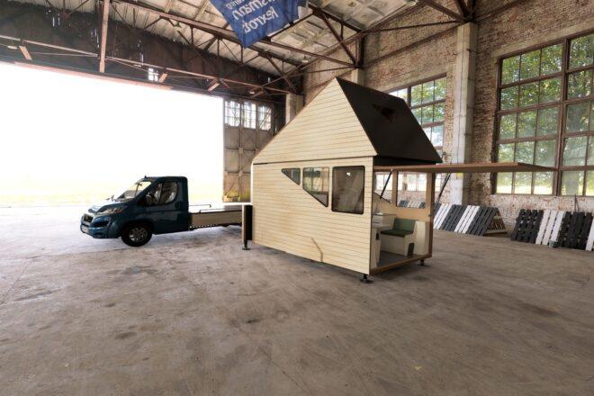 wooden camper inside large garage space