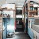 kitchen area with white tiles and teal cabinets