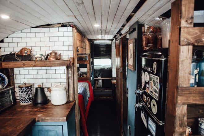 teal kitchen cabinets inside a school bus