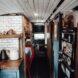 teal kitchen cabinets inside a school bus