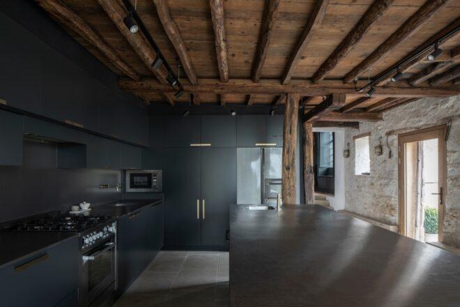modern kitchen with island and wooden ceiling