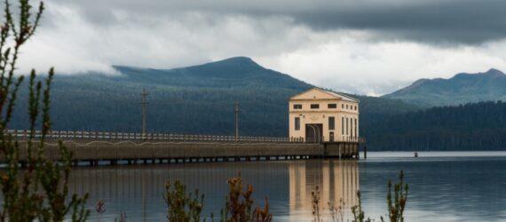 large tan art deco building on a lake